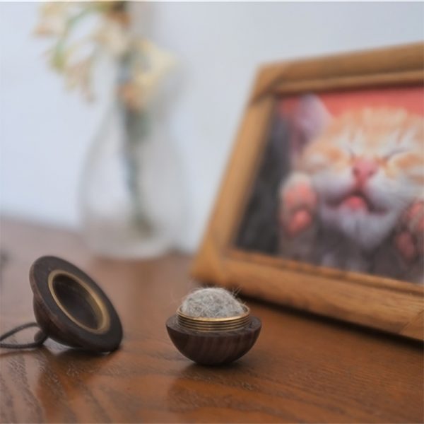 a black walnut pet ashes necklace with dog's hair